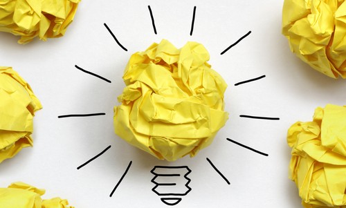 Inspiration concept crumpled paper light bulb metaphor for good